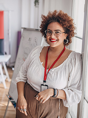 Woman looking at mobile device displaying an employee engagement questionnaire