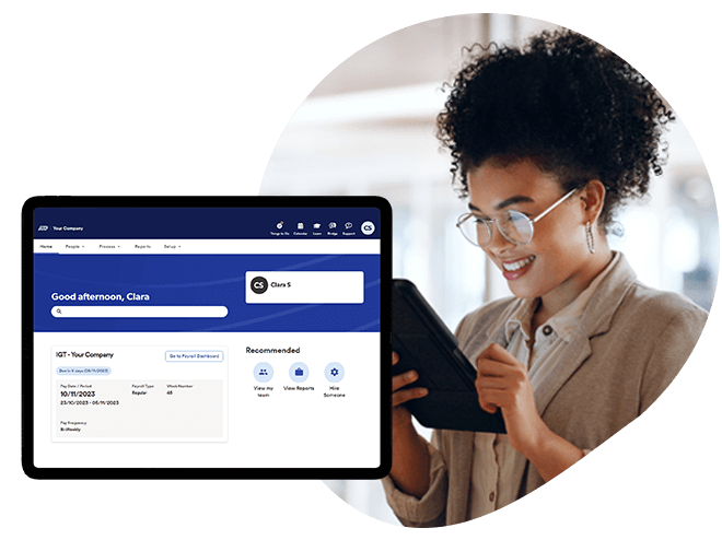 Woman processing payroll on her tablet